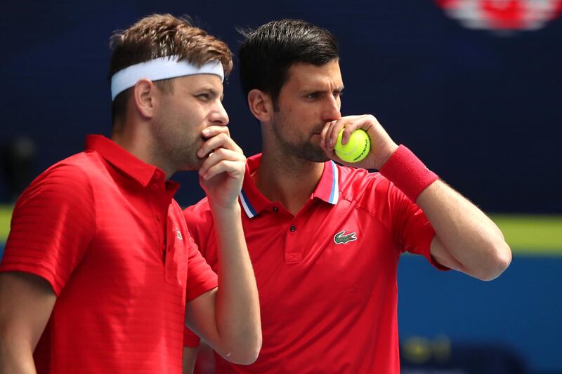 Serbia's Novak Djokovic and Filip Krajinovic during their ATP Cup group stage doubles match against Canada's Denis Shapovalov and Milos Raonic at Melbourne Park. Reuters