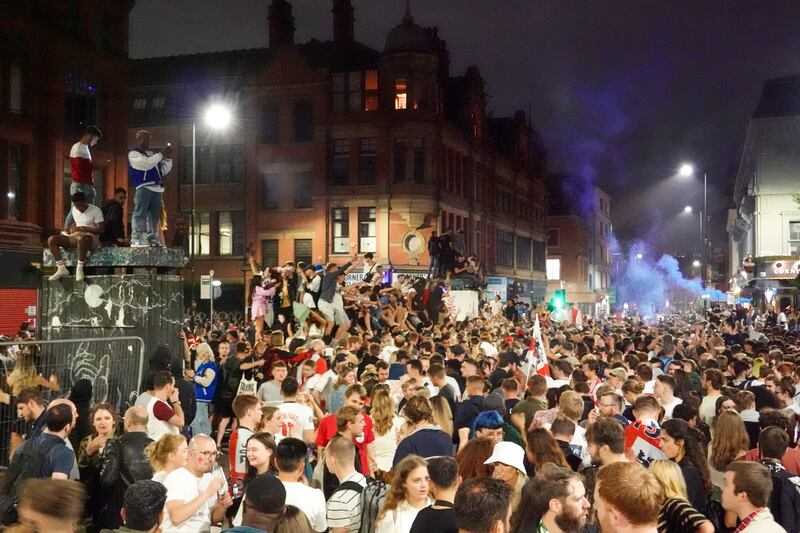 England fans gather in Stevenson Square, Manchester, after Italy beat their team lift the trophy.