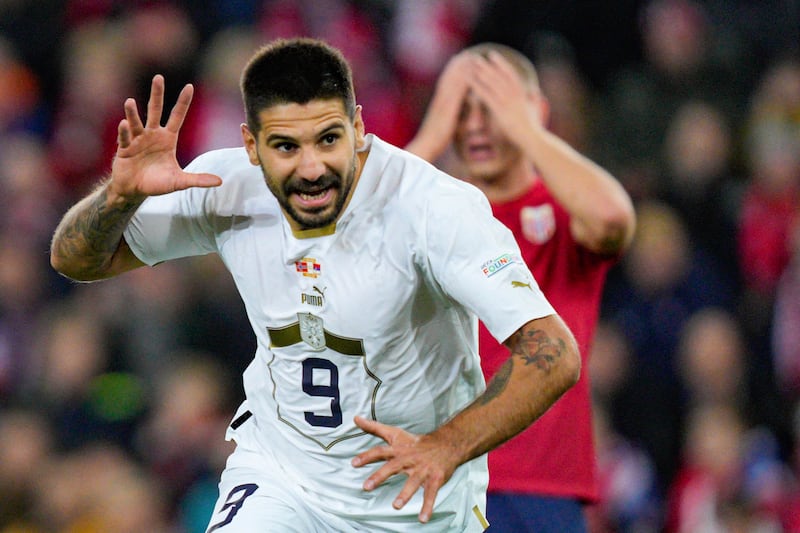 Serbia's Aleksandar Mitrovic celebrates after scoring to 0-2 during the Nations League soccer match between Norway and Serbia at Ullevaal Stadium in Oslo, Norway, Tuesday Sept.  27, 2022.  (Javad Parsa / NTB Scanpix via AP)
