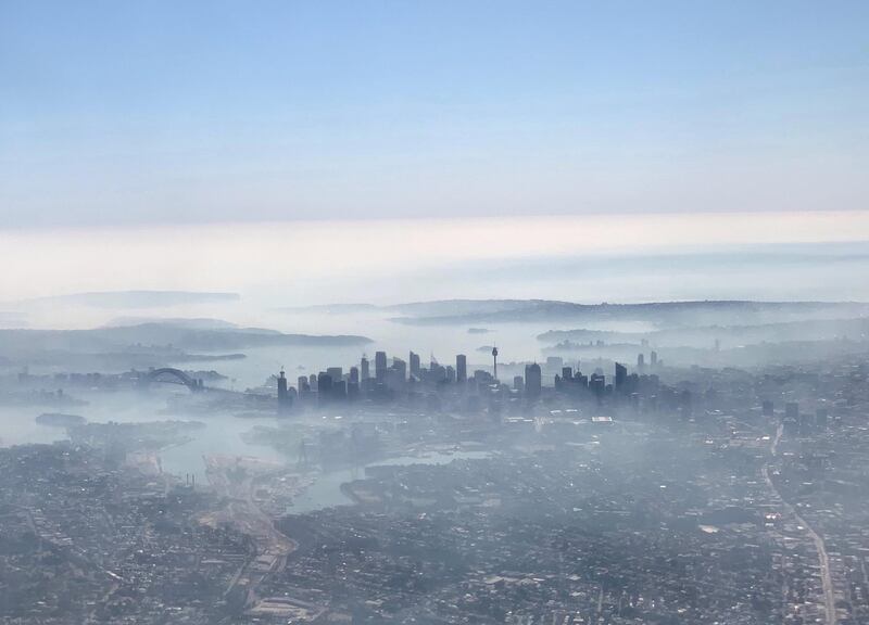 An image taken on a smart phone from a plane window shows smoke haze blanketing Sydney, Australia, November 19, 2019. AAP Image/Neil Bennett/via REUTERS    ATTENTION EDITORS - THIS IMAGE WAS PROVIDED BY A THIRD PARTY. NO RESALES. NO ARCHIVE. AUSTRALIA OUT. NEW ZEALAND OUT.