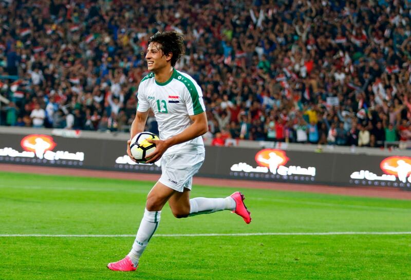 Iraq's Muhanad Ali celebrates scoring a goal. Haidar Mohammed Ali / AFP