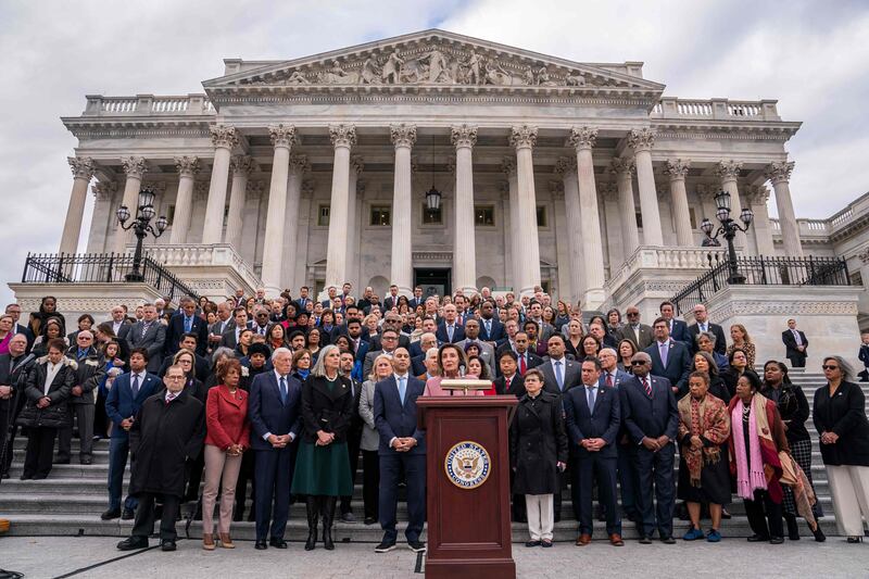 Nancy Pelosi, the former House speaker, speaks during a remembrance ceremony outside the Capitol. Getty / AFP