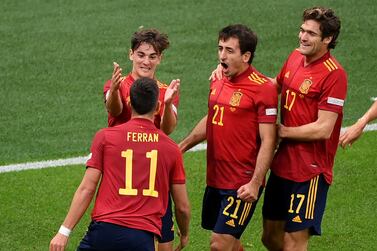 Soccer Football - UEFA Nations League - Semi Final - Italy v Spain - San Siro, Milan, Italy - October 6, 2021 Spain's Ferran Torres celebrates scoring their first goal with teammates Pool via REUTERS / Marco Bertorello     TPX IMAGES OF THE DAY