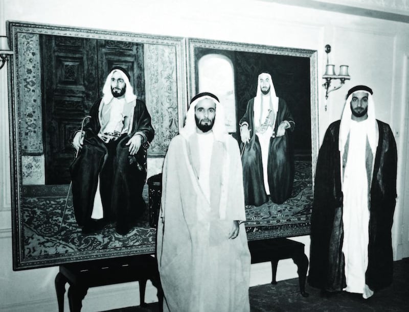 Sheikh Zayed with his brother, Sheikh Hazza bin Sultan Al Nahyan, in front of official portraits during a visit to London in 1957