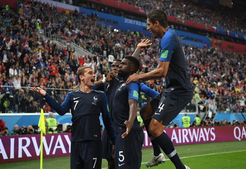 SAINT PETERSBURG, RUSSIA - JULY 10:  Samuel Umtiti of France celebrates with team mates after scoring his team's first goal during the 2018 FIFA World Cup Russia Semi Final match between Belgium and France at Saint Petersburg Stadium on July 10, 2018 in Saint Petersburg, Russia.  (Photo by Shaun Botterill/Getty Images)