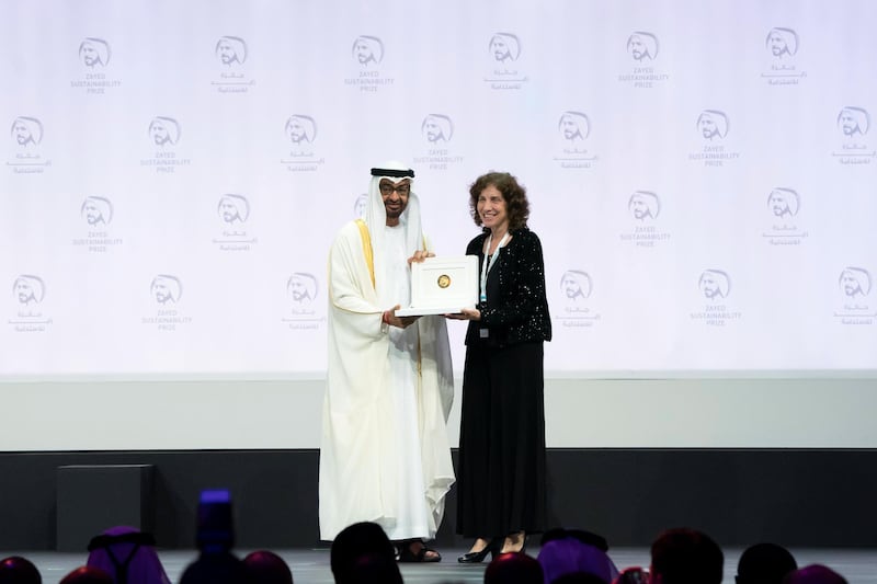 ABU DHABI, UNITED ARAB EMIRATES - January 14, 2019:  HH Sheikh Mohamed bin Zayed Al Nahyan, Crown Prince of Abu Dhabi and Deputy Supreme Commander of the UAE Armed Forces (L), presents an award to a representative from 'We Care Solar', winners of the Zayed Sustainability Prize for Health, at Abu Dhabi National Exhibition Centre (ADNEC).


( Hamed Al Mansoori / Ministry of Presidential Affairs )
---