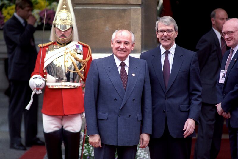 Gorbachev and British Prime Minister John Major pose for a picture after the Soviet leader's arrival at Lancaster House, London, in July 1991. PA