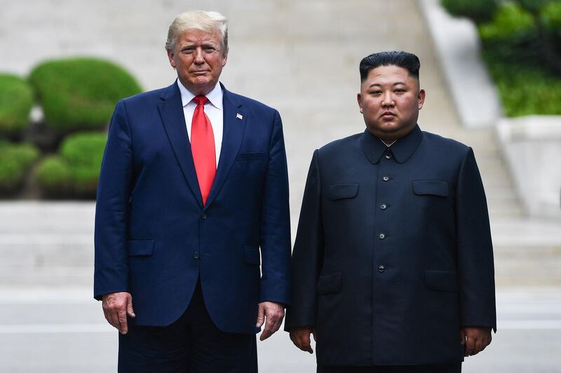 US President Donald Trump poses with North Korean leader Kim Jong-un at the demilitarised zone separating the two Koreas, in Panmunjom, South Korea. AFP