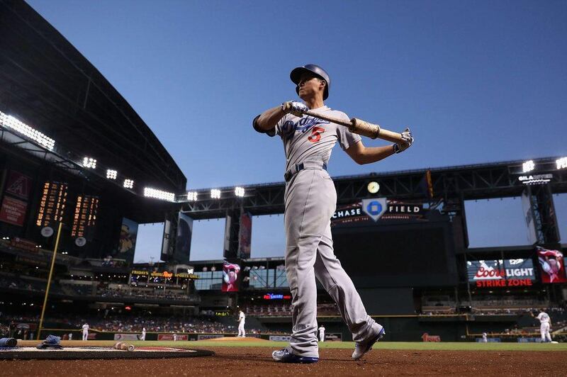 Corey Seager of the Los Angeles Dodgers warms up on deck during the first inning against the Arizona Diamondbacks last week. Christian Petersen / Getty Images / AFP / September 16, 2016