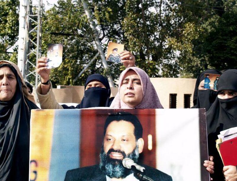 Amna Masood Janjua, centre, who believes her husband is being held without charge in Pakistan, campaigns in Rawalpindi.