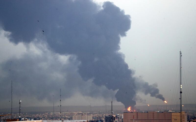 Smoke rises from the oil refinery, the main one serving Tehran. EPA