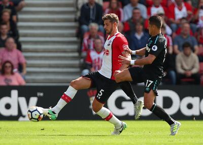 Soccer Football - Premier League - Southampton vs West Ham United - Southampton, Britain - August 19, 2017  Southampton's Jack Stephens in action with West Ham United's Javier Hernandez    REUTERS/Hannah McKay     EDITORIAL USE ONLY. No use with unauthorized audio, video, data, fixture lists, club/league logos or "live" services. Online in-match use limited to 45 images, no video emulation. No use in betting, games or single club/league/player publications. Please contact your account representative for further details.