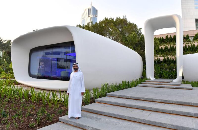 Sheikh Mohammed bin Rashid, Vice President and Ruler of Dubai, stands outside the 3D printed building on the Emirates Towers premises which houses Dubai Future Academy. Wam