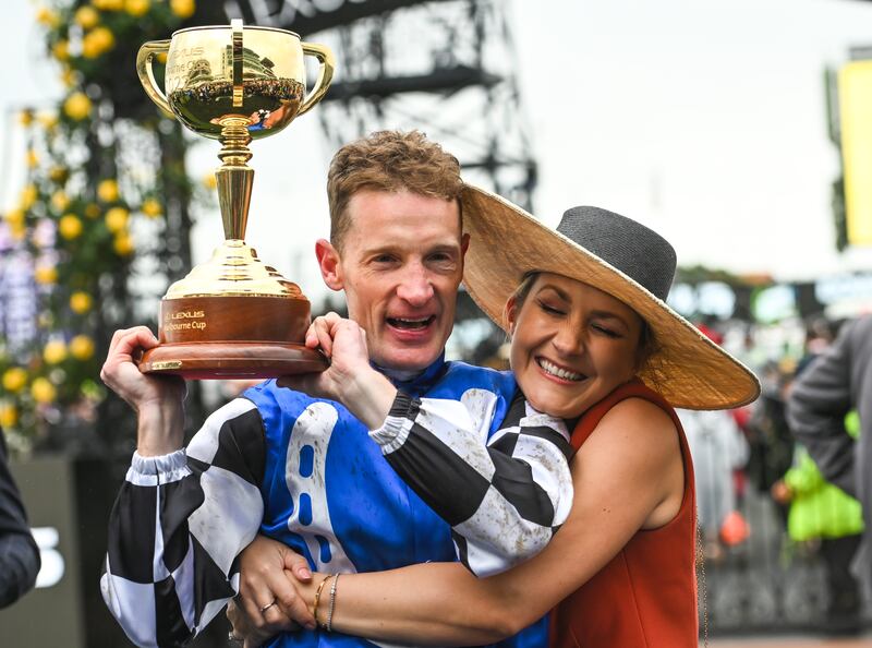 Mark Zahra is kissed by wife Elyse Zahra after riding Gold Trip to win the Melbourne Cup. Getty Images