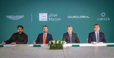 Stefano Saporetti (second from right), director of brand diversification at Aston Martin, and Ziad El Chaar (right), chief executive of Dar Global, during the signing ceremony. Photo Dar Global