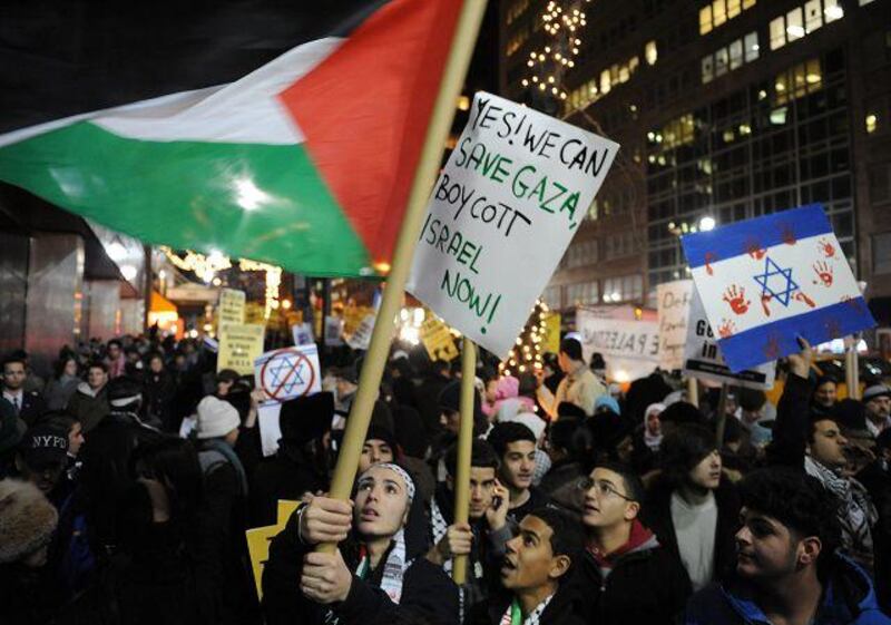 A coalition of groups demonstrate against the offensive near the Israeli Consulate in New York.