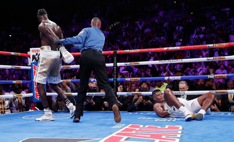 Deontay Wilder walks away after knocking down Luis Ortiz. AP