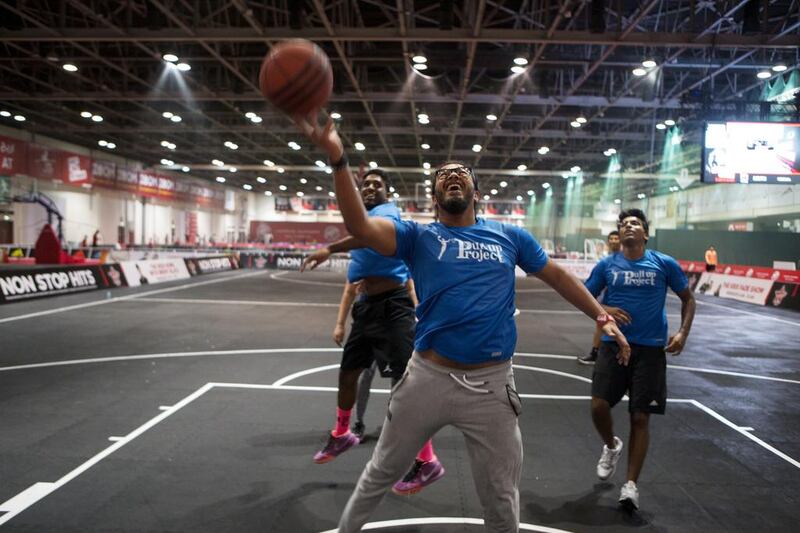 Members of the Pull Up Project play pick-up basketball at Dubai Sports World. The Pull Up Project mentora youth through physical activity. Christopher Pike / The National