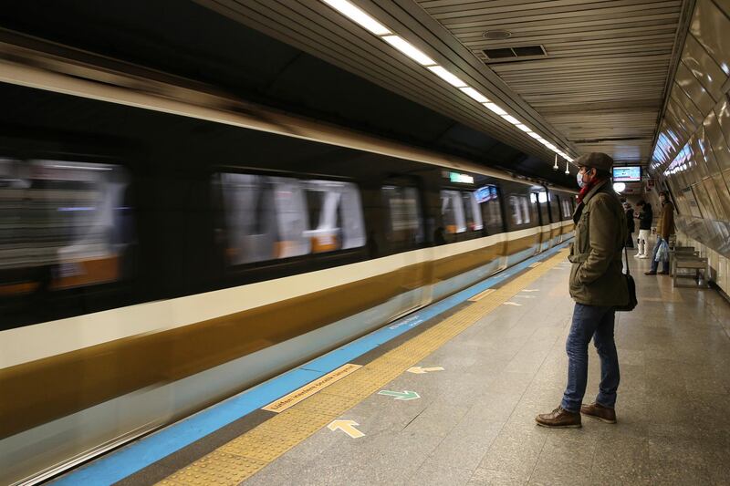 A commuter wears a mask in an underground station during the coronavirus outbreak in central Istanbul, Friday, April 3, 2020. The new coronavirus causes mild or moderate symptoms for most people, but for some, especially older adults and people with existing health problems, it can cause more severe illness or death. (AP Photo/Emrah Gurel)