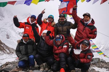 Nirmal "Nims" Purja, Dawa Tenji Sherpa (team MG), Mingma G, Dawa Temba Sherpa and Pem Chiri Sherpa, Mingma David Sherpa, Mingma Tenzi Sherpa, Nimsdai Purja and Gelje Sherpa are seen during the Puja ceremony before the winter attack on K2, Pakistan, January 5, 2021. Picture taken January 5, 2021. NIMSDAI/RED BULL CONTENT POOL/Handout via REUTERS. THIS IMAGE HAS BEEN SUPPLIED BY A THIRD PARTY. MANDATORY CREDIT. NO RESALES. NO ARCHIVES. NO NEW USES AFTER SIX MONTHS. NO USE ON YOUTUBE. REFILE- CORRECTING CREDIT.