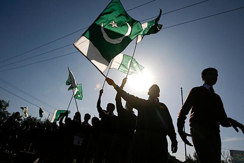 Students wave Pakistan's national flag while taking part in an anti-American demonstration in Peshawar on November 30, 2011.  A senior Pakistani army official has said a NATO cross-border air attack that killed 24 soldiers was a deliberate, blatant act of aggression, hardening Pakistan's stance on an incident that could hurt efforts to stabilise Afghanistan.   REUTERS/Khuram Parvez   (PAKISTAN - Tags: POLITICS CIVIL UNREST TPX IMAGES OF THE DAY)