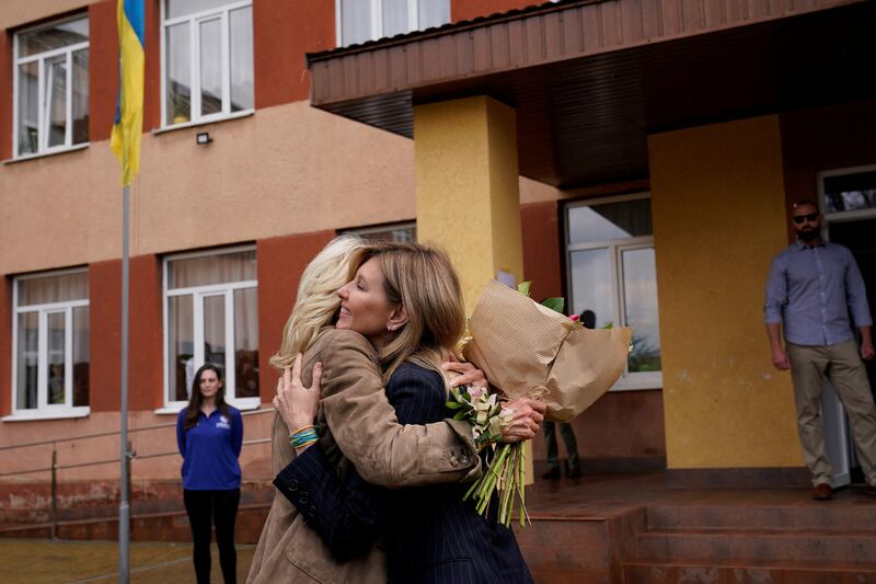 Ms Zelenska hugs Mrs Biden, who made the unannounced visit to Ukraine by crossing the border from Slovakia. Reuters