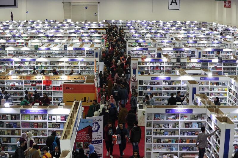 Visitors browse books during the 51st Cairo International Book Fair at Egypt International Exhibition Center, Cairo, Egypt.  EPA