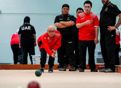 Al Ain, UAE, March 8, 2018.  UAE Special Olympics team training sessions.  UAE BOCCE Team.  Mahmoud Jaharoo throws the ball as his team mates watch on.
Victor Besa / The National
National
Reporter; Ramola Talwar