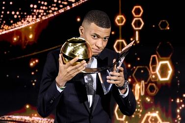 This handout picture made available on December 27, 2021 shows French footballer Kylian Mbappe accepting the "Best Men's Player of the Year" award during the 2021 Globe Soccer Awards ceremony at the Burj Khalifa in Dubai.  (Photo by Fabio FERRARI  /  La Presse  /  AFP)  /  === RESTRICTED TO EDITORIAL USE - MANDATORY CREDIT "AFP PHOTO  /  HO  /  Dubai Globe Soccer Awards" - NO MARKETING NO ADVERTISING CAMPAIGNS - DISTRIBUTED AS A SERVICE TO CLIENTS ===