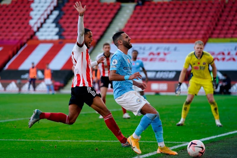 Manchester City's Riyad Mahrez runs the ball  out of play. AFP