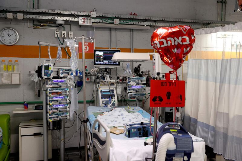 A heart-shaped balloon by a patient's bed, at the neonatal intensive care unit after the department was moved to an underground parking of the Sheba medical center in the Israeli city of Ramat Gan near Tel Aviv, on May 18. AFP