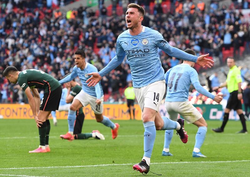 epa09159094 Manchester City's Aymeric Laporte (front) celebrates after scoring the 1-0 lead during the Carabao Cup Final between Manchester City and Tottenham Hotspur at Wembley in London, Britain, 25 April 2021.  EPA/ANDY RAIN EDITORIAL USE ONLY. No use with unauthorized audio, video, data, fixture lists, club/league logos or 'live' services. Online in-match use limited to 120 images, no video emulation. No use in betting, games or single club/league/player publications.