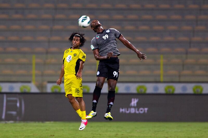 Dubai, United Arab Emirates, October 28, 2012:   Al Wasl's Hassan Ali, left, and Al Dhafra's Makheta Diop jump for the ball during the second half of their Pro League match at Zabeel Stadium in Dubai on October 28, 2012. Christopher Pike / The National