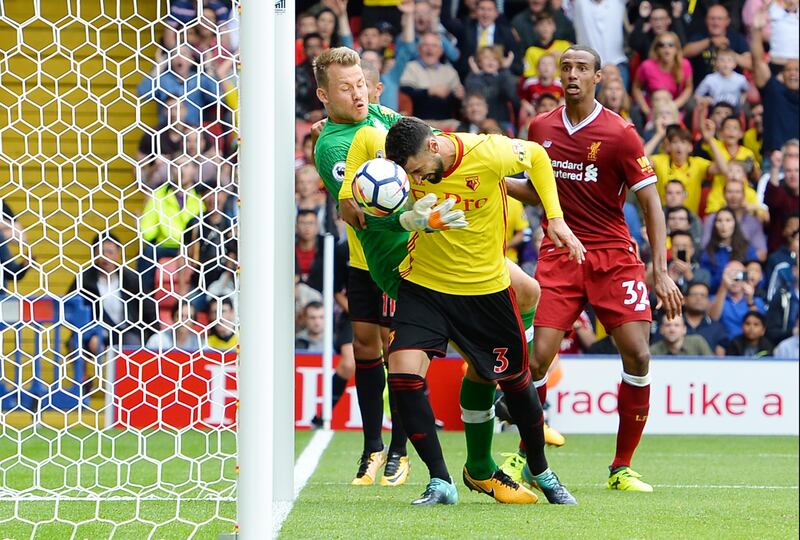 WATFORD, ENGLAND - AUGUST 12:  Miguel Britos of Watford scores his sides third goal past Simon Mignolet of Liverpool during the Premier League match between Watford and Liverpool at Vicarage Road on August 12, 2017 in Watford, England.  (Photo by Tony Marshall/Getty Images)