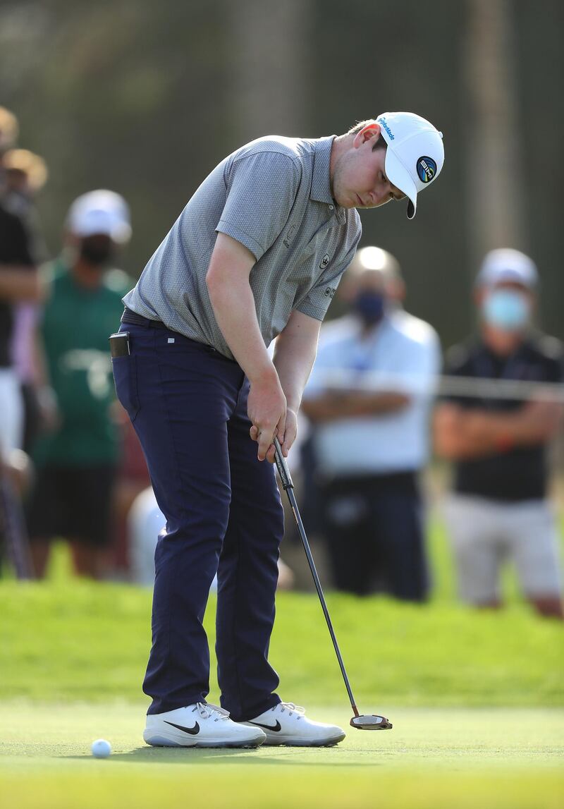 Robert Macintyre putts on the 14th hole. Getty