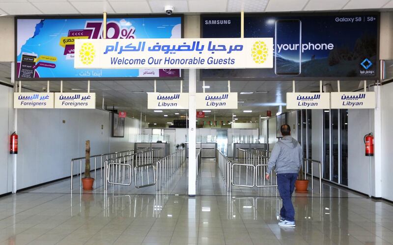 A man walks inside Mitiga airport the day after militiamen attacked it in an attempt to free colleagues held at a jail there, on the eastern outskirts of the Libyan capital Tripoli, on January 16, 2018.
Mitiga airport, a former military air base on the eastern outskirts of the capital, was evacuated when the clashes erupted and roads to the facility were closed. / AFP PHOTO / Mahmud TURKIA