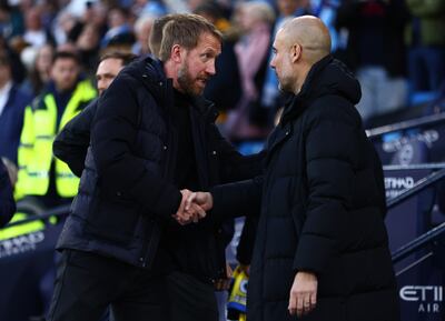 Brighton manager Graham Potter with City boss Pep Guardiola. Getty