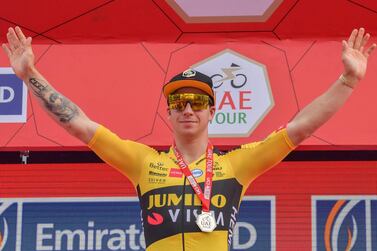 Jumbo Visma rider Dylan Groenewegen celebrates on the podium after winning stage four of the UAE Tour in Dubai on Wednesday. AFP