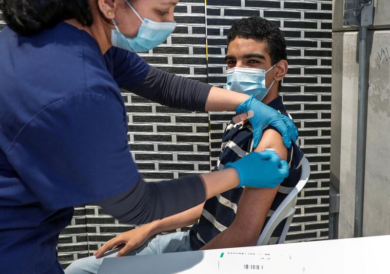 Abu Dhabi, United Arab Emirates, March 30, 2021.  Ahmed Osman gets vaccinated at the Biogenix Labs at G42 in Masdar City. 
Victor Besa/The National
Section:  NA
Reporter:  Shireena Al Nowais
