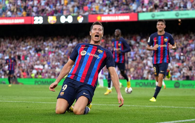 Robert Lewandowski celebrates after scoring Barcelona's first goal. Getty