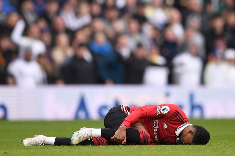 Manchester United's Marcus Rashford lies injured. AFP