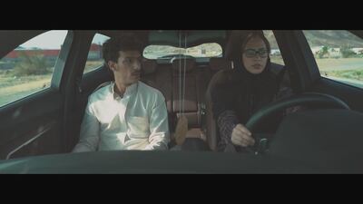 A woman named Razan (Razan Tariq) stops to pick up Oudah (Wael Ghobaish) in the film. Courtesy Anas Alhumaid