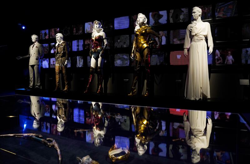 Costumes worn in the film 'Wonder Woman 1984' are displayed in the Action and Magic Made Here interactive experience.