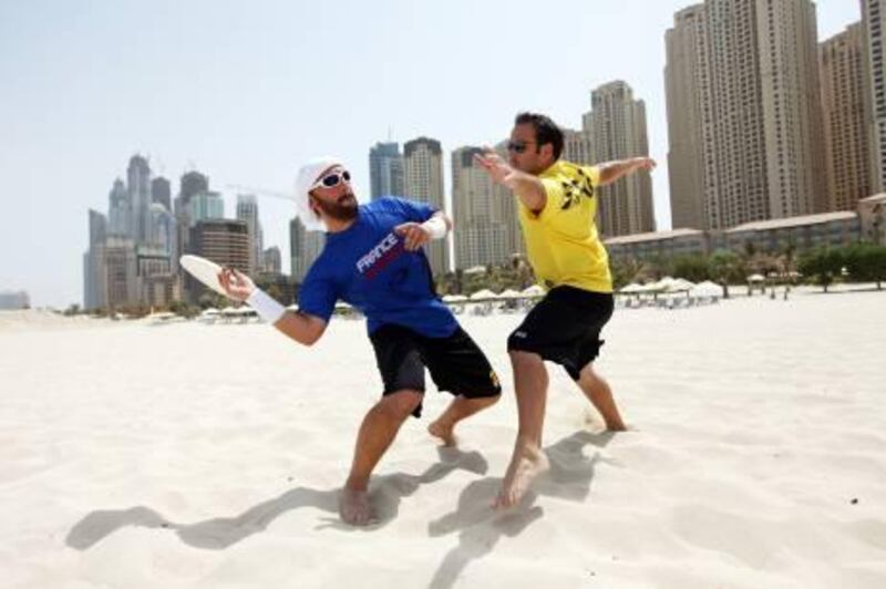 Rich-Joseph Facun/The National (Tuesday, August 30, 2011) UAE Ultimate Frisbee team members  Patrick Fourcampre-Maye(CQ), left and Matthieu Roshay, (CQ) right, practice their skills on the beach, Wednesday, August 30, 2011 in Dubai. 