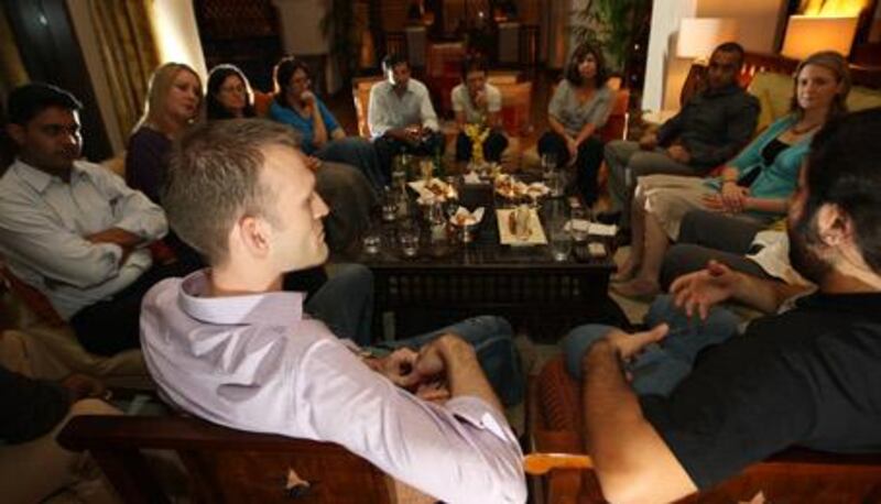 Matt Swift (left), leads a meeting of 'Rendezvous,' at the Palace Hotel in Dubai. The new monthly discussion group is devoted to talking about 'the things that really matter in life... without getting heavy'.