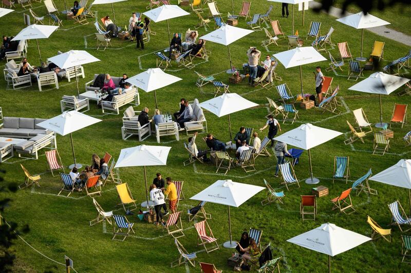 Festival-goers experience the Gisburne Park Pop-Up, the first purpose-built outdoor festival in the UK factoring in social-distancing rules, while in their designated pitches on the Gisburne Park Estate in the village of Gisburn, near Clitheroe, northern England. AFP