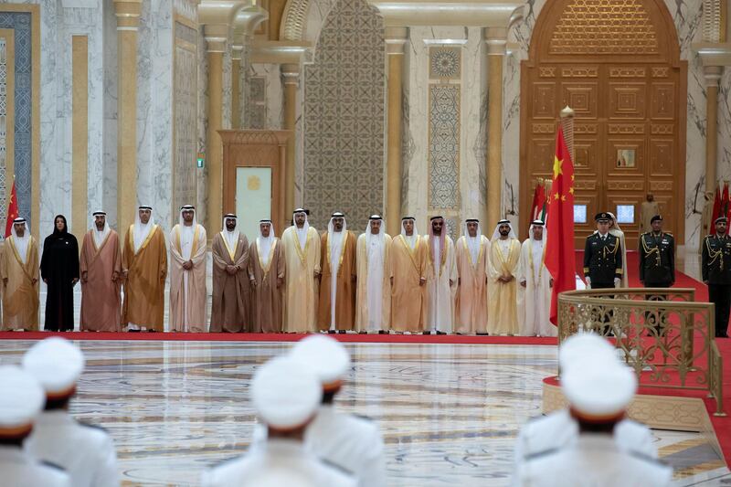 ABU DHABI, UNITED ARAB EMIRATES - July 20, 2018: (R-L) HH Sheikh Hazza bin Zayed Al Nahyan, Vice Chairman of the Abu Dhabi Executive Council, HH Sheikh Mohamed bin Rashid Al Maktoum, Vice-President, Prime Minister of the UAE, Ruler of Dubai and Minister of Defence, HH Lt General Sheikh Saif bin Zayed Al Nahyan, UAE Deputy Prime Minister and Minister of Interior, HH Sheikh Tahnoon bin Zayed Al Nahyan, UAE National Security Advisor, HH Sheikh Mansour bin Zayed Al Nahyan, UAE Deputy Prime Minister and Minister of Presidential Affairs, HH Sheikh Abdullah bin Zayed Al Nahyan, UAE Minister of Foreign Affairs and International Cooperation, HH Major General Sheikh Khaled bin Mohamed bin Zayed Al Nahyan, Deputy National Security Adviser, HE Mohamed Abdulla Al Gergawi, UAE Minister of Cabinet Affairs and the Future, HE Sultan bin Saeed Al Mansouri, UAE Minister of Economy, HE Mohamed Ahmad Al Bowardi, UAE Minister of State for Defence Affairs, HE Dr Sultan Ahmed Al Jaber, UAE Minister of State, Chairman of Masdar and CEO of ADNOC Group, HE Khaldoon Khalifa Al Mubarak CEO and Managing Director Mubadala, Chairman of the Abu Dhabi Executive Affairs Authority (EAA), and Abu Dhabi Executive Council Member, HE Mohamed Mubarak Al Mazrouei, Undersecretary of the Crown Prince Court of Abu Dhabi, HE Reem Ibrahim Al Hashimi, UAE Minister of State for International Cooperation and HE Suhail bin Mohamed Faraj Faris Al Mazrouei, UAE Minister of Energy, attend a reception for HE Xi Jinping, President of China (not shown), at the Presidential Palace. 

( Hamad Al Kaabi / Crown Prince Court - Abu Dhabi )
---