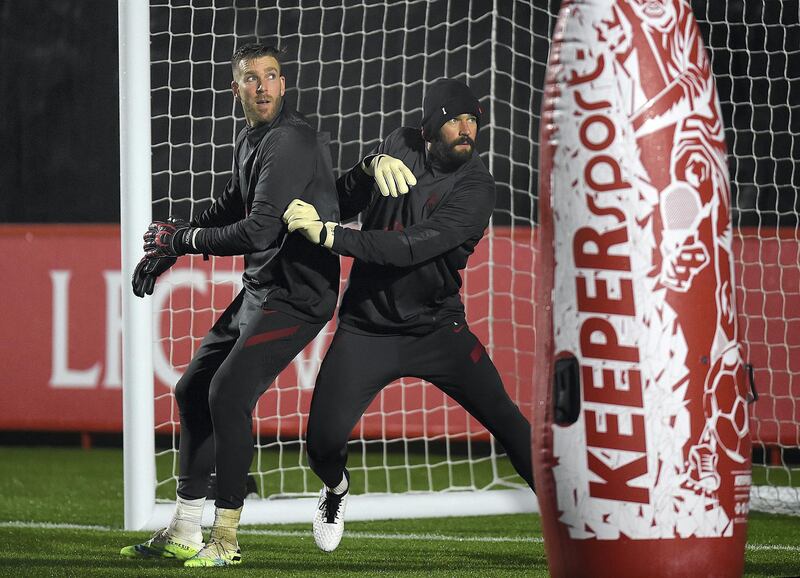 KIRKBY, ENGLAND - DECEMBER 11: (THE SUN OUT. THE SUN ON SUNDAY OUT)  Alisson Becker of Liverpool with Adrian of Liverpool during a training session at AXA Training Centre on December 11, 2020 in Kirkby, England. (Photo by John Powell/Liverpool FC via Getty Images)