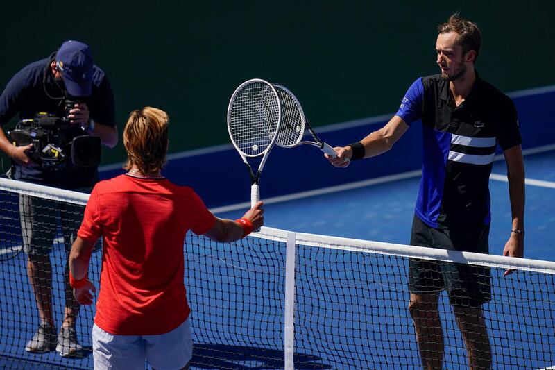 Daniil Medvedev greets J.J. Wolf at the net after their US Open third round match. AP Photo