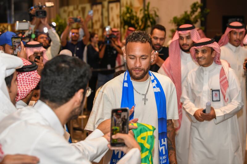 Neymar is surrounded by fans after his arrival at the King Khalid International Airport in Riyadh. AP